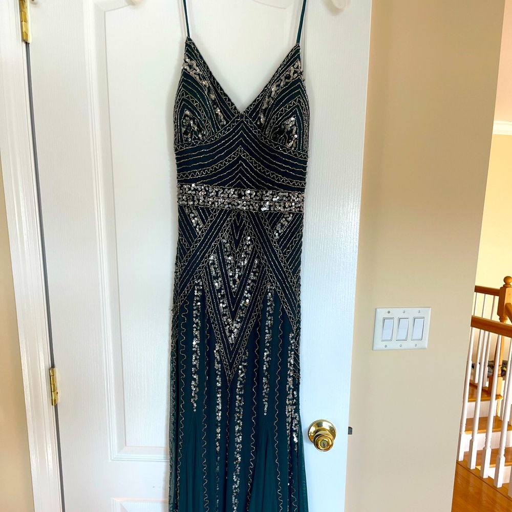 Evening gown/ Prom gown
Marina brand, hunter green, beaded gown, size 10